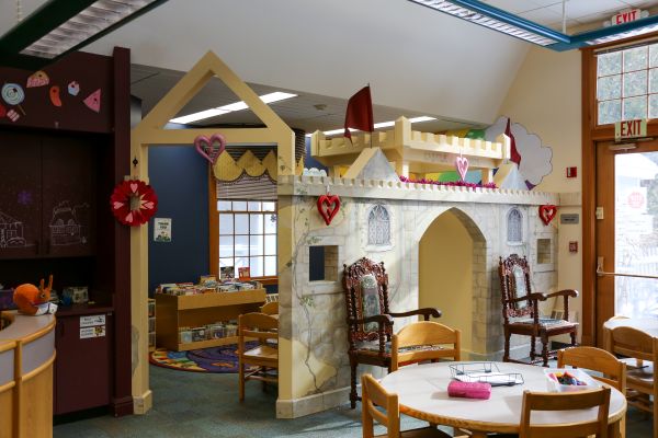 Nesmith Library's Children's Room, featuring our castle, tables and chairs, and educational toys