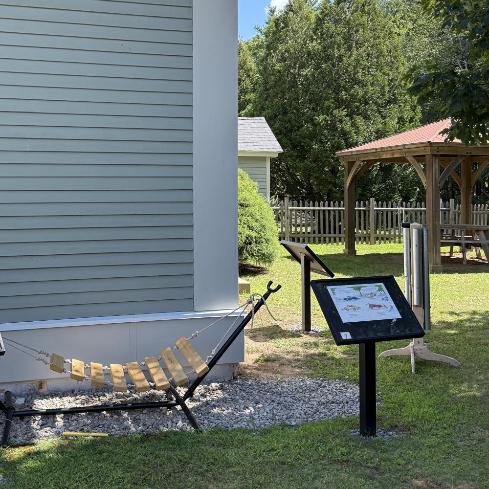 The xylophone in the storygarden, next to a part of the storywalk. 