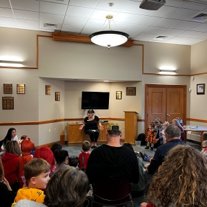 Librarian Joan leading Halloween storytime